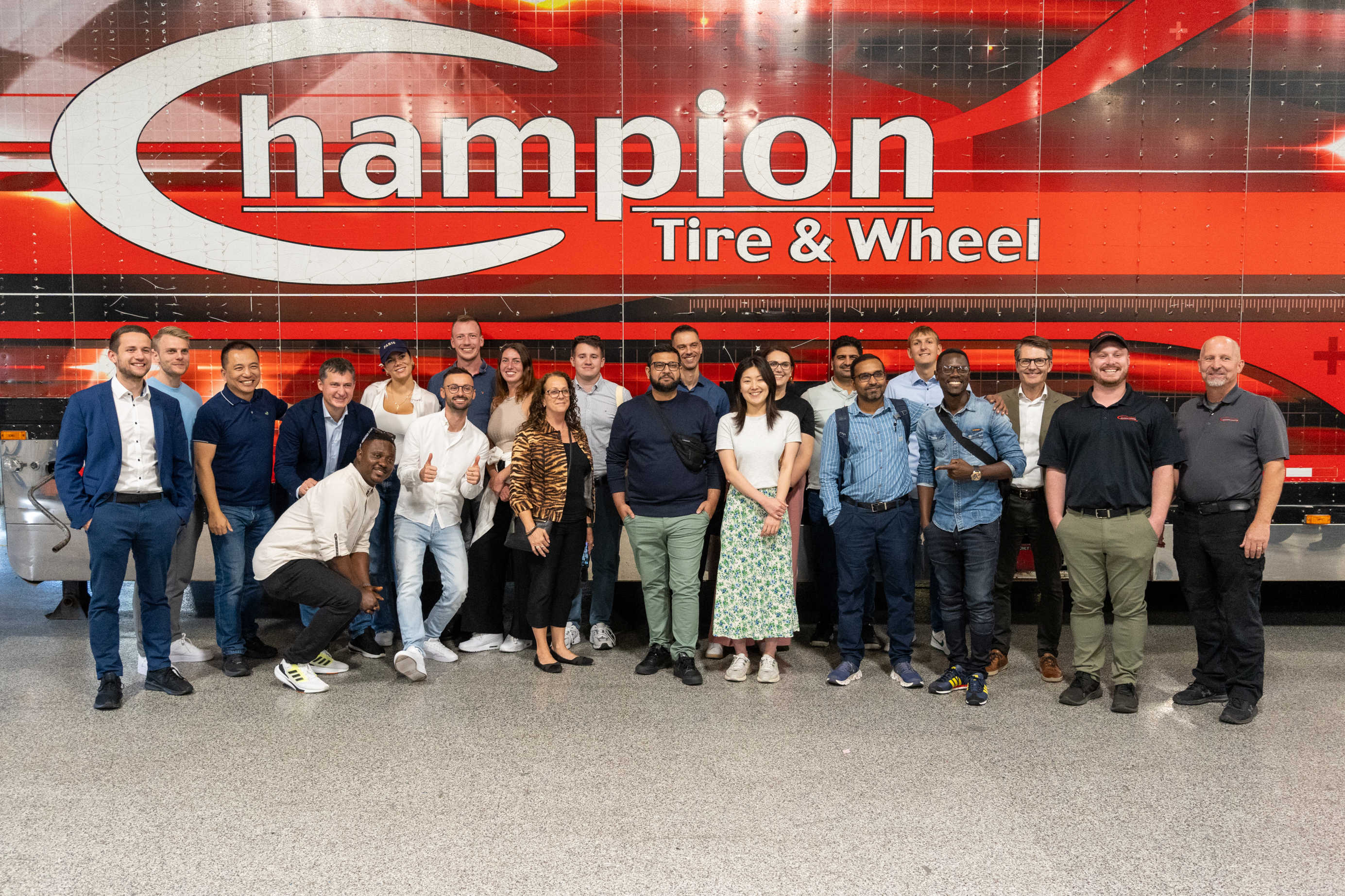 MBA students and professors with team from Champion Tire & Wheel