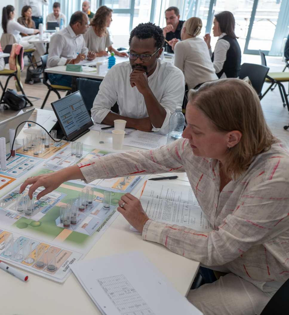 MBA students playing a business simulation game