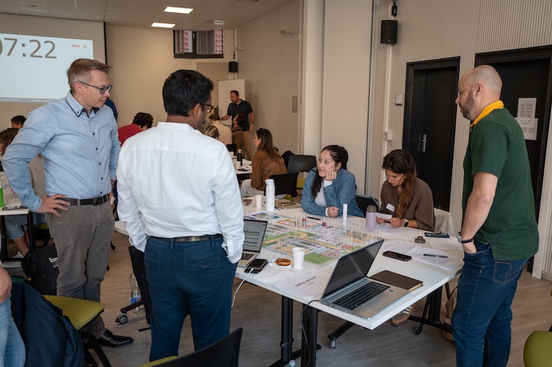 MBA students playing a business simulation game
